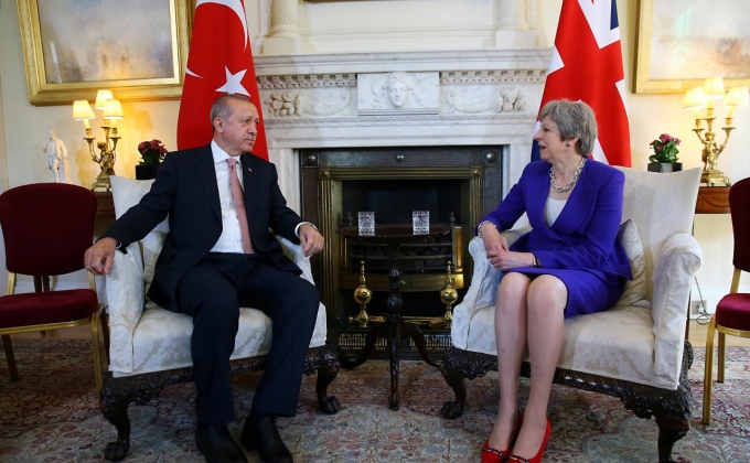 UK PM May warns Turkey's Erdogan not to lose sight of democratic values