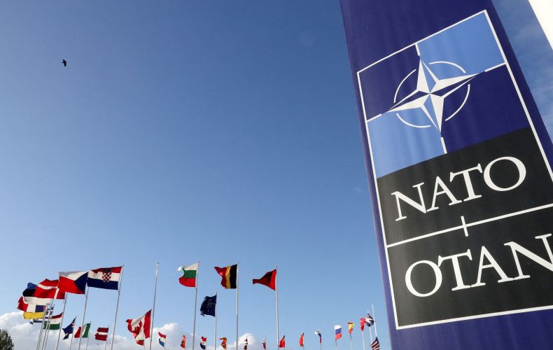 Ukraine cannot join NATO amid fighting in its territory: EU commissioner